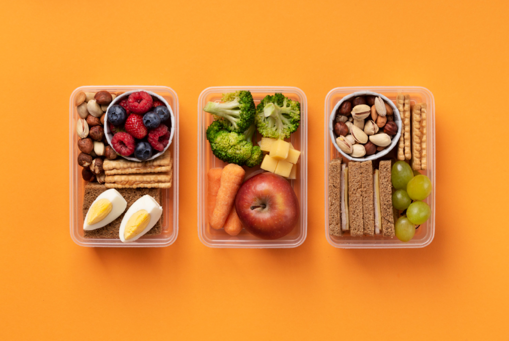 three food boxes on an orange background